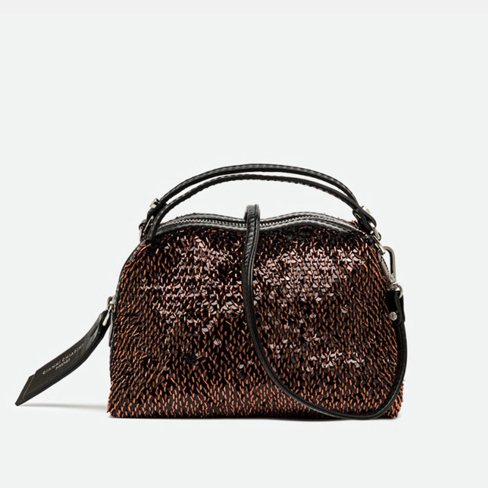 Small bronze sequinned handbag with black leather handles and a crossbody strap