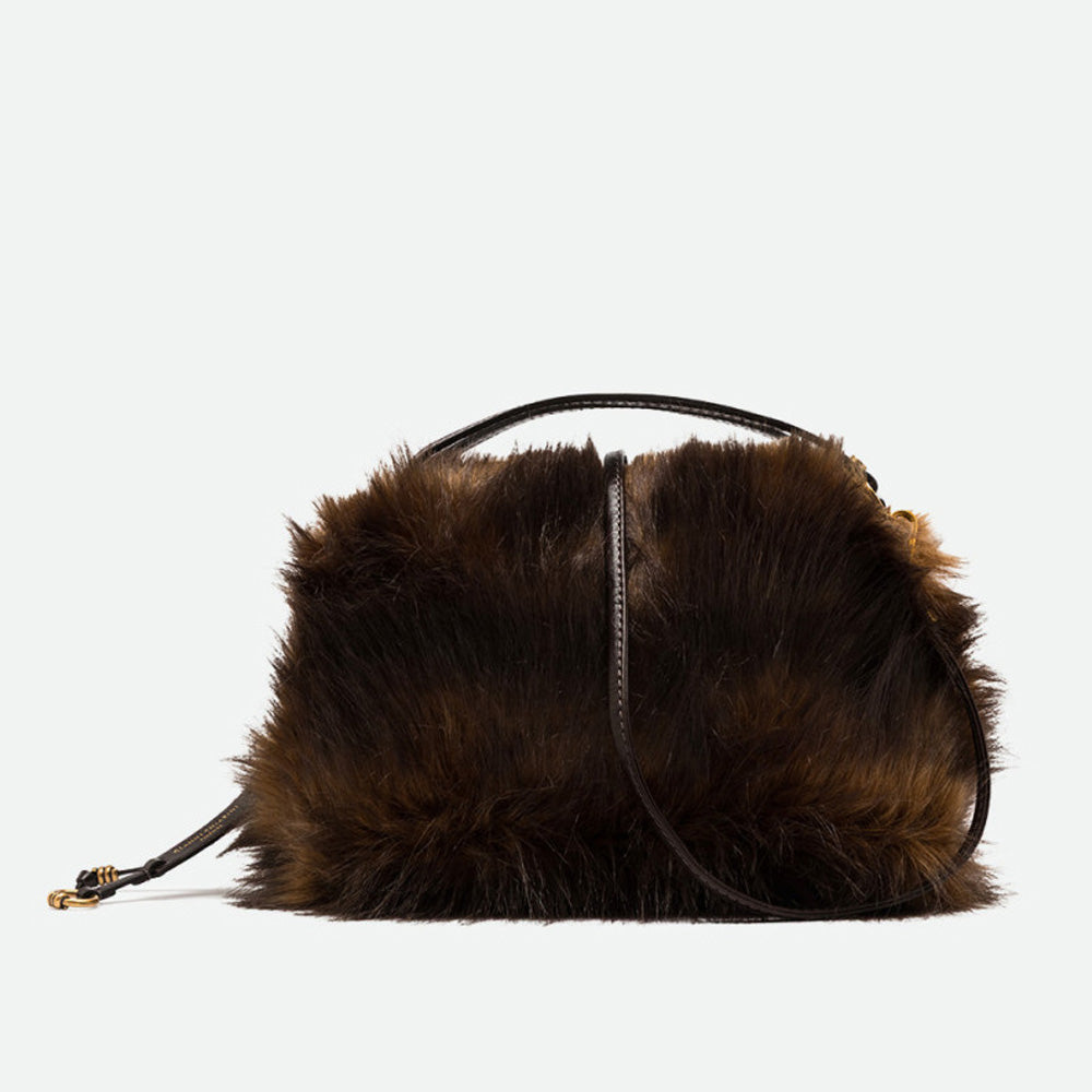 Brown faux fur handbag with dark brown leather handles and a crossbody strap