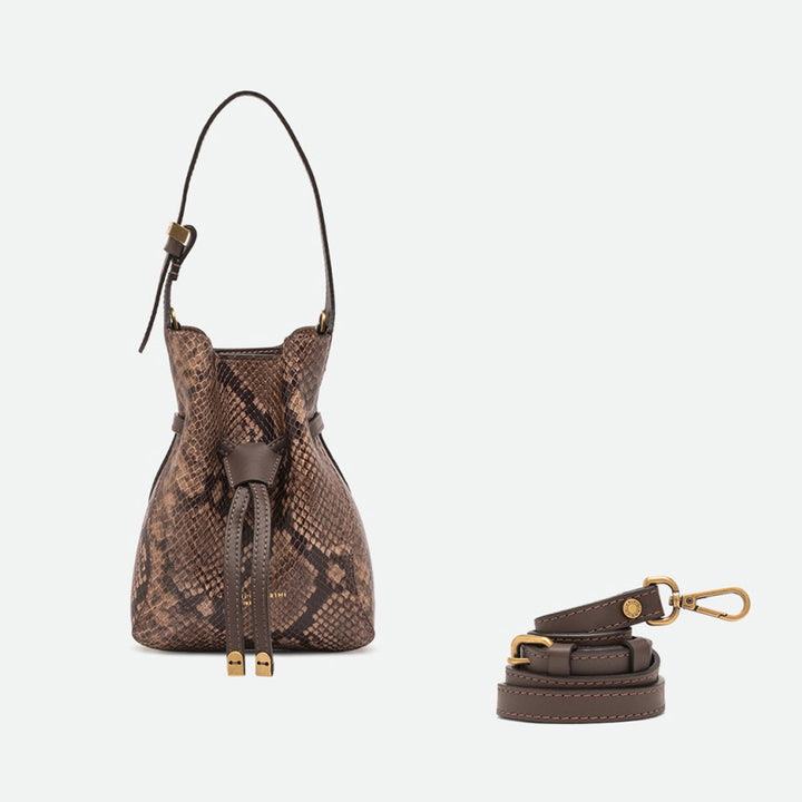 Small brown snake print bucket bag shown beside a separate crossbody strap