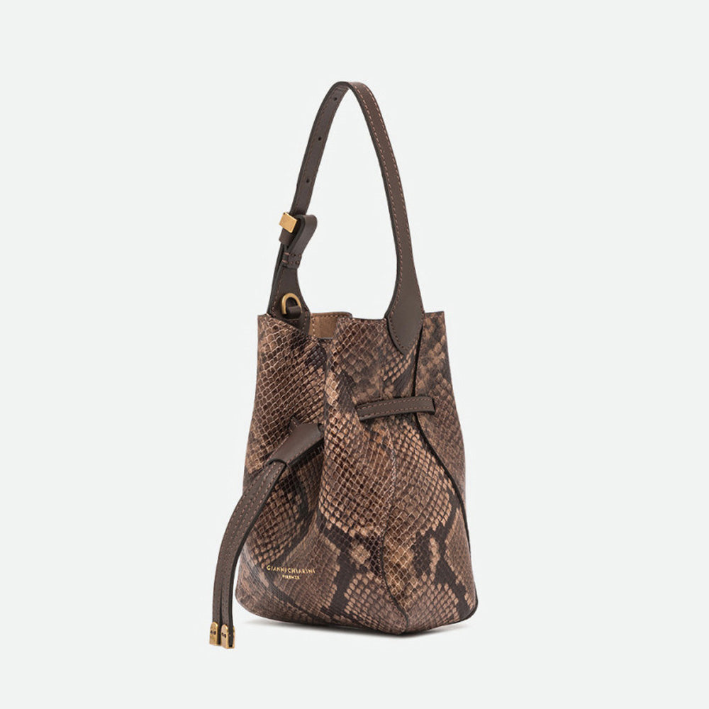 Side view of a brown snake print bucket bag with gold-tipped drawstrings