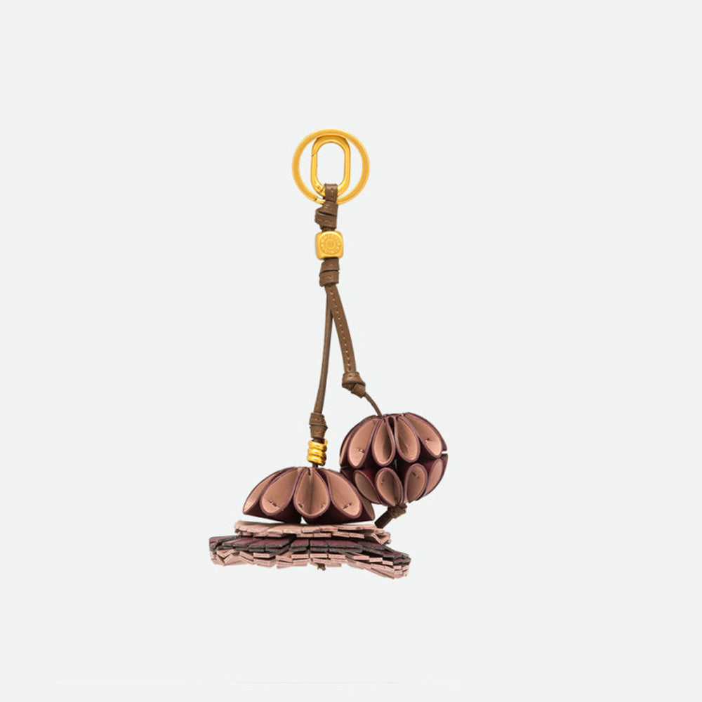 Reverse side of a pink petal flower bag charm