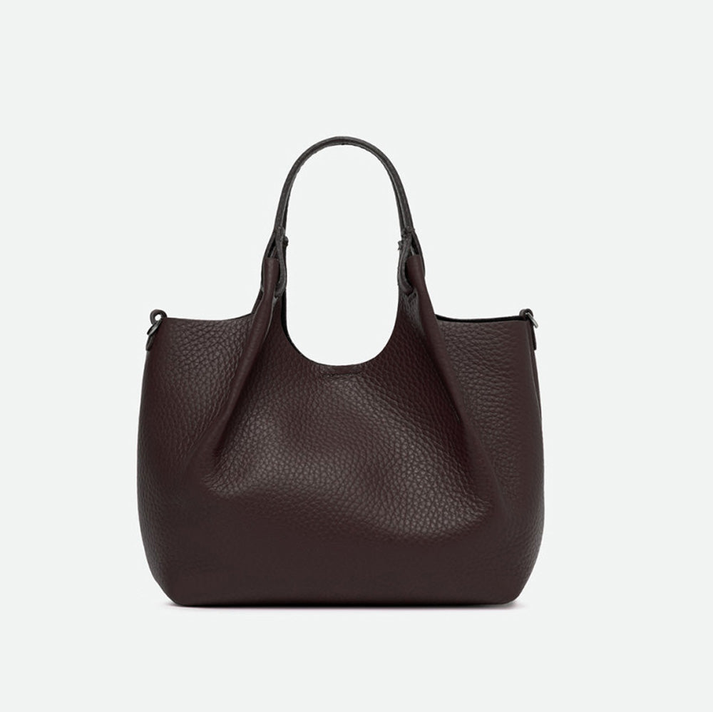 Front of a dark brown pebbled leather tote with its sides opened out
