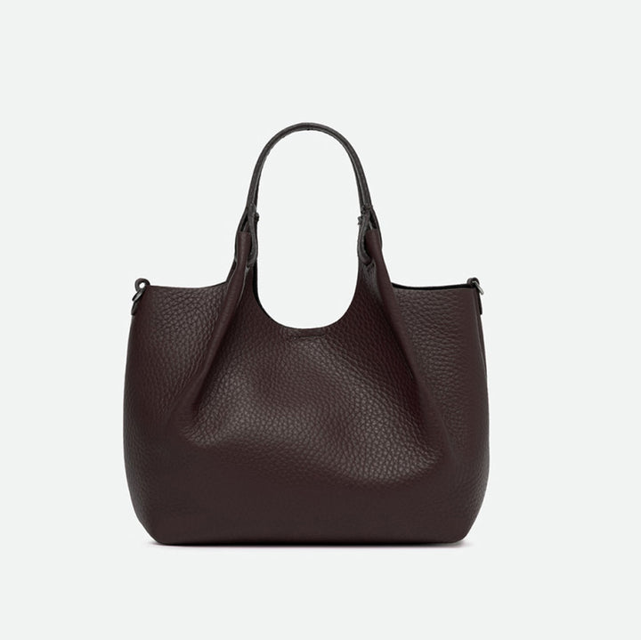 Front of a dark brown pebbled leather tote with its sides opened out