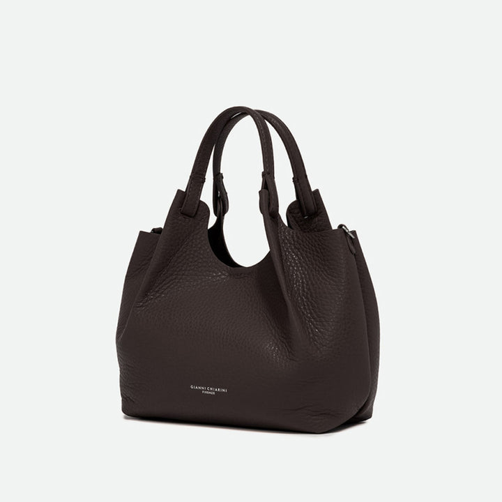 Angled view of a dark brown pebbled leather tote bag