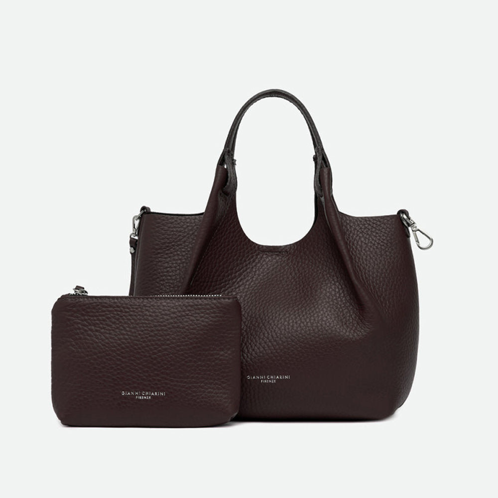 Dark brown leather tote bag shown with a matching zip pouch