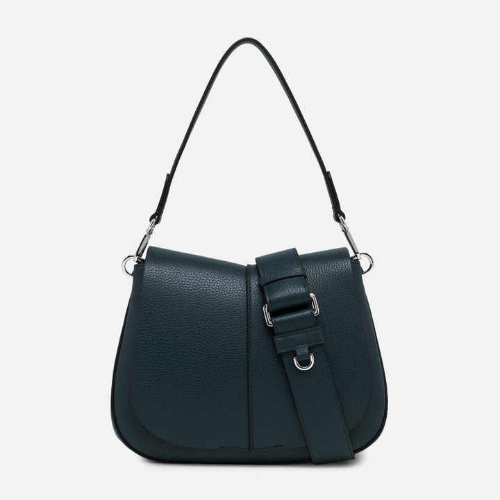 Front of a dark green leather shoulder bag with a curved flap and buckled strap