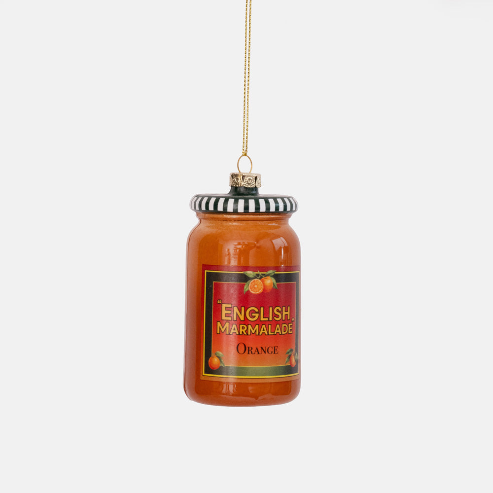 Glass ornament shaped like an orange jar of English marmalade with a red label and black and white striped lid