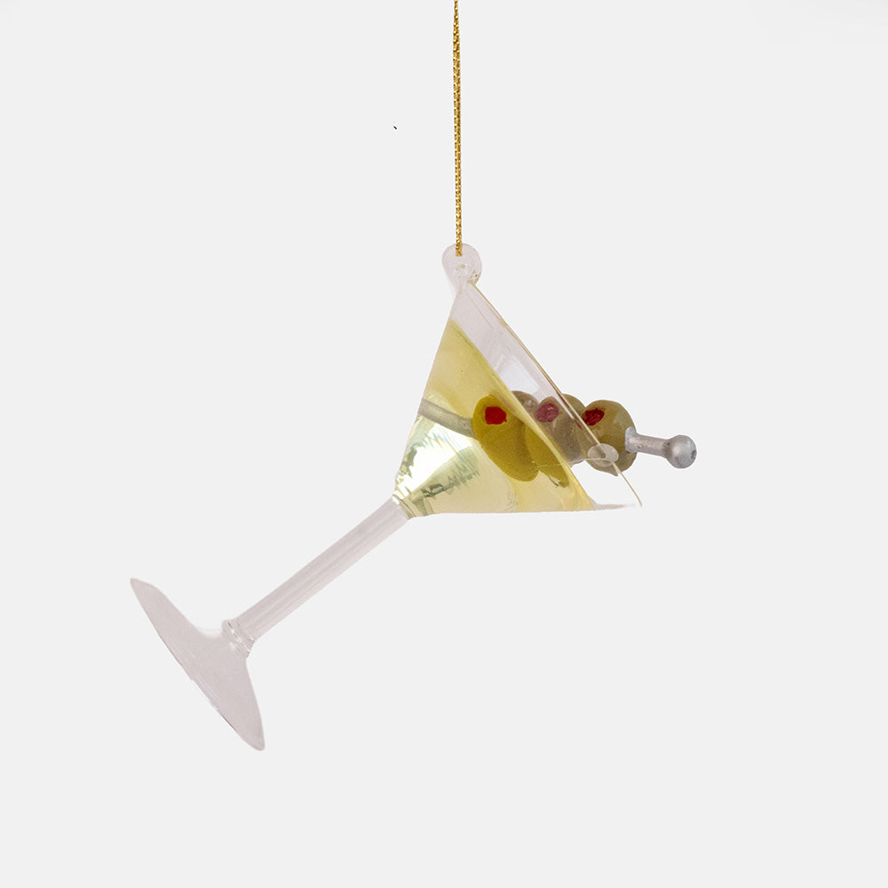 Clear glass ornament shaped like a martini glass with a pale drink and green olives on a silver cocktail stick