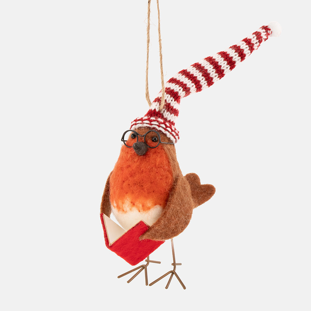 a felt christmas tree decoration of a robin with a red & white striped knitted hat, wire glasses and holding a red book in it's wings