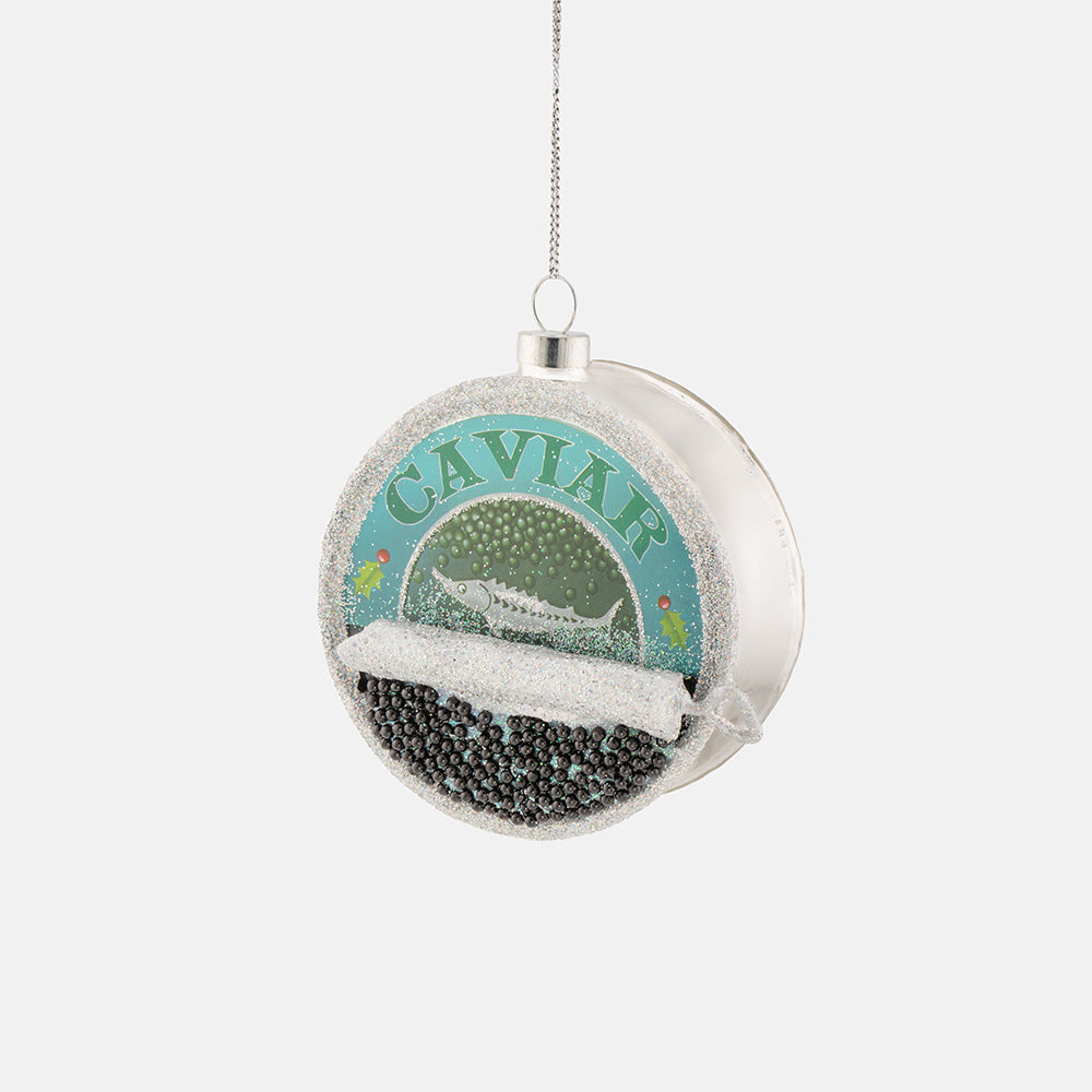 a hanging christmas tree decoration in the shape of a can of caviar in silver & blue on a light grey background