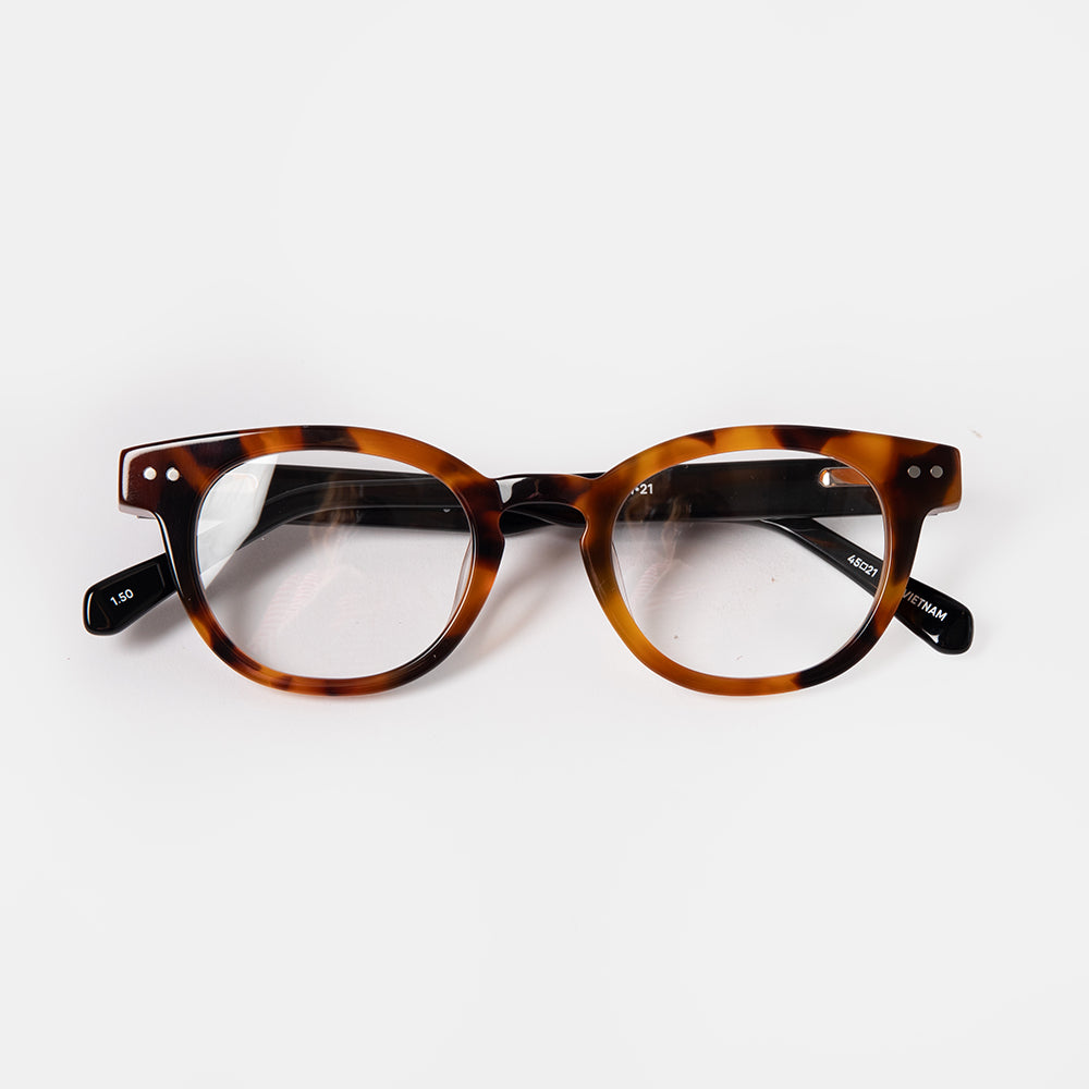 Tortoiseshell eyeglasses on a white background