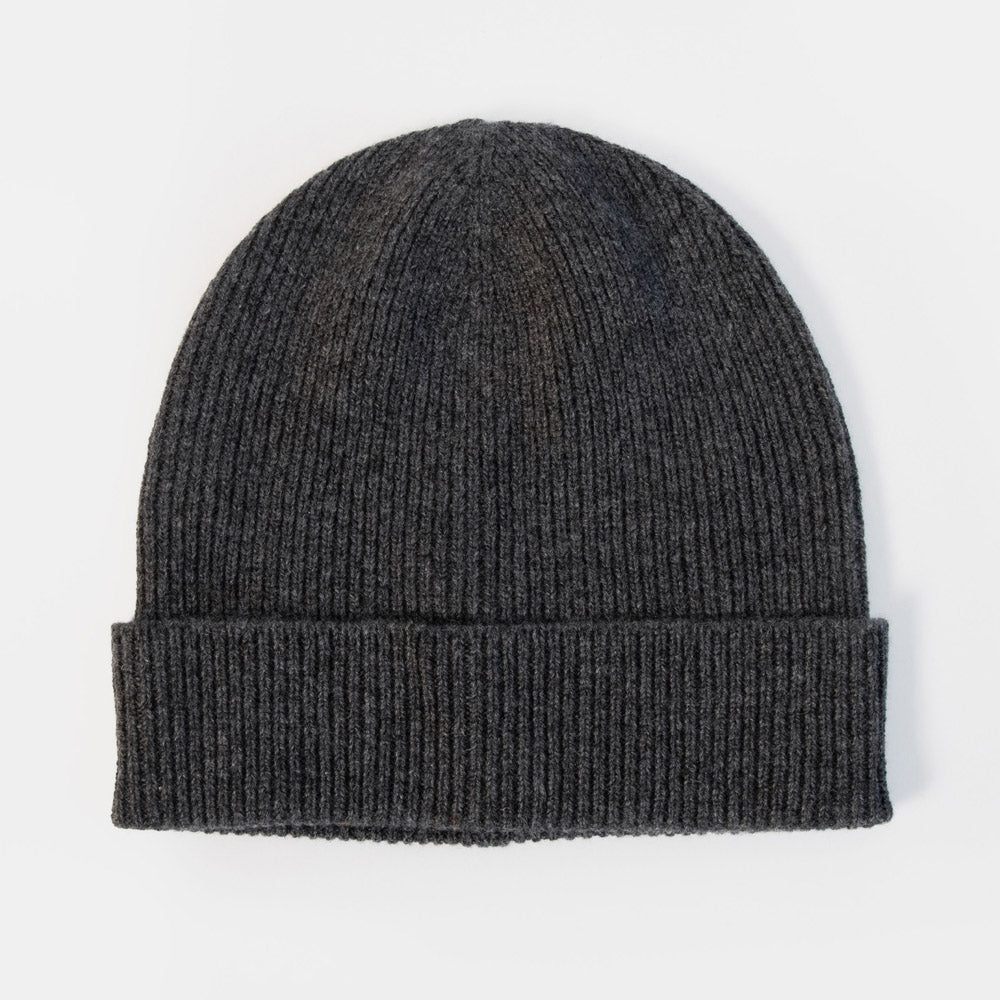 A dark charcoal gray ribbed knit beanie hat with a folded cuff, shown against a plain white background.