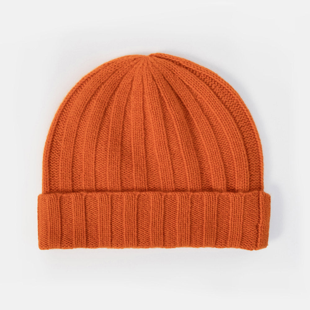 A bright orange ribbed knit beanie hat, shown flat against a clean white background.