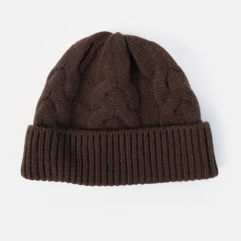 A dark brown cable-knit beanie hat with a ribbed cuff, shown against a plain white background.