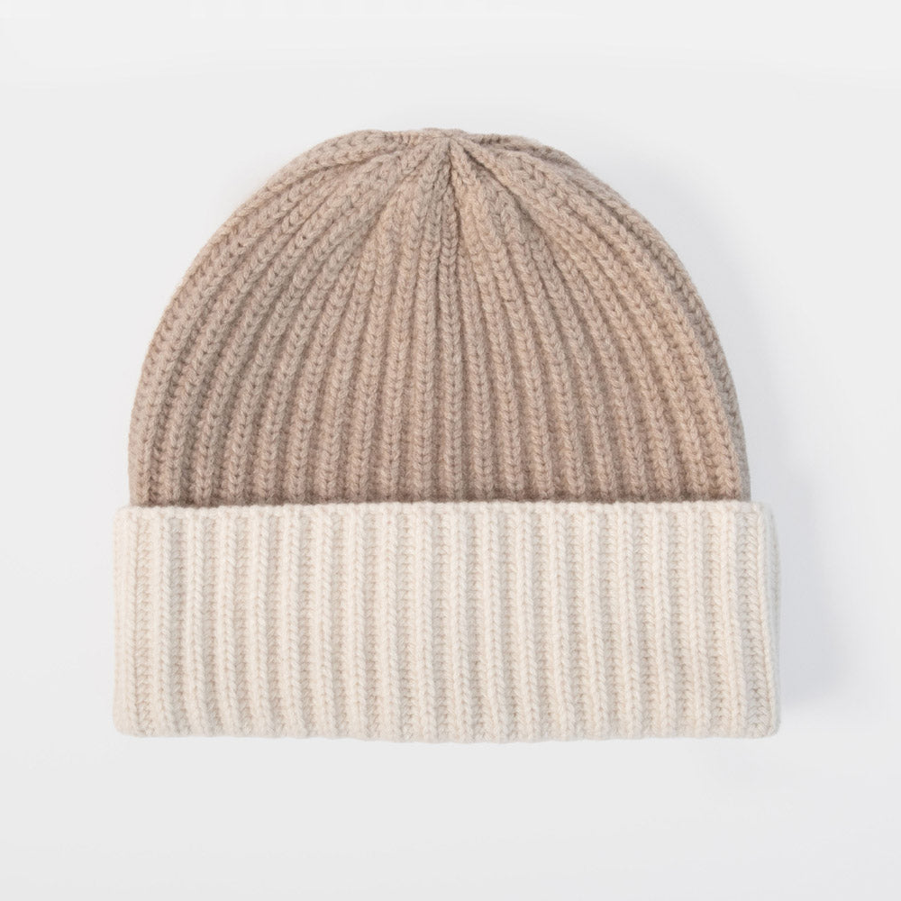 A ribbed knit beanie hat with a two-tone design, featuring a taupe-brown upper section and an off-white folded cuff, shown against a plain white background.