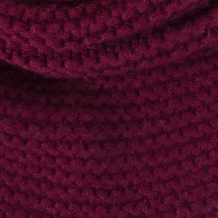 A close-up of a textured knit fabric in a deep burgundy or plum purple color, showing the detailed crochet or knit stitches and soft folds.