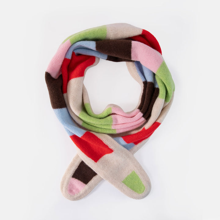 multi coloured striped scarf looped into a circle against a white background