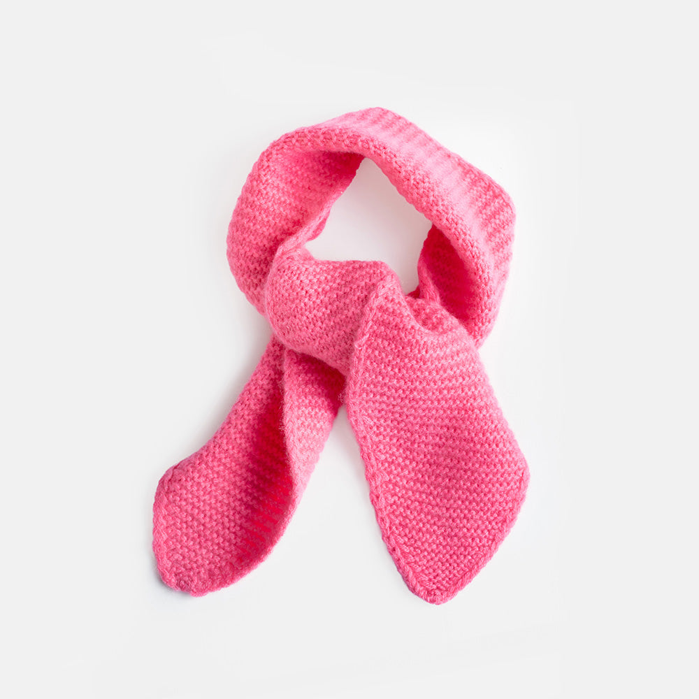 A bright pink knitted scarf tied in a loop, displayed against a clean white background.