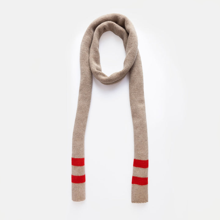 A beige knit scarf with two red stripes near the ends, arranged in a loop on a clean white background.