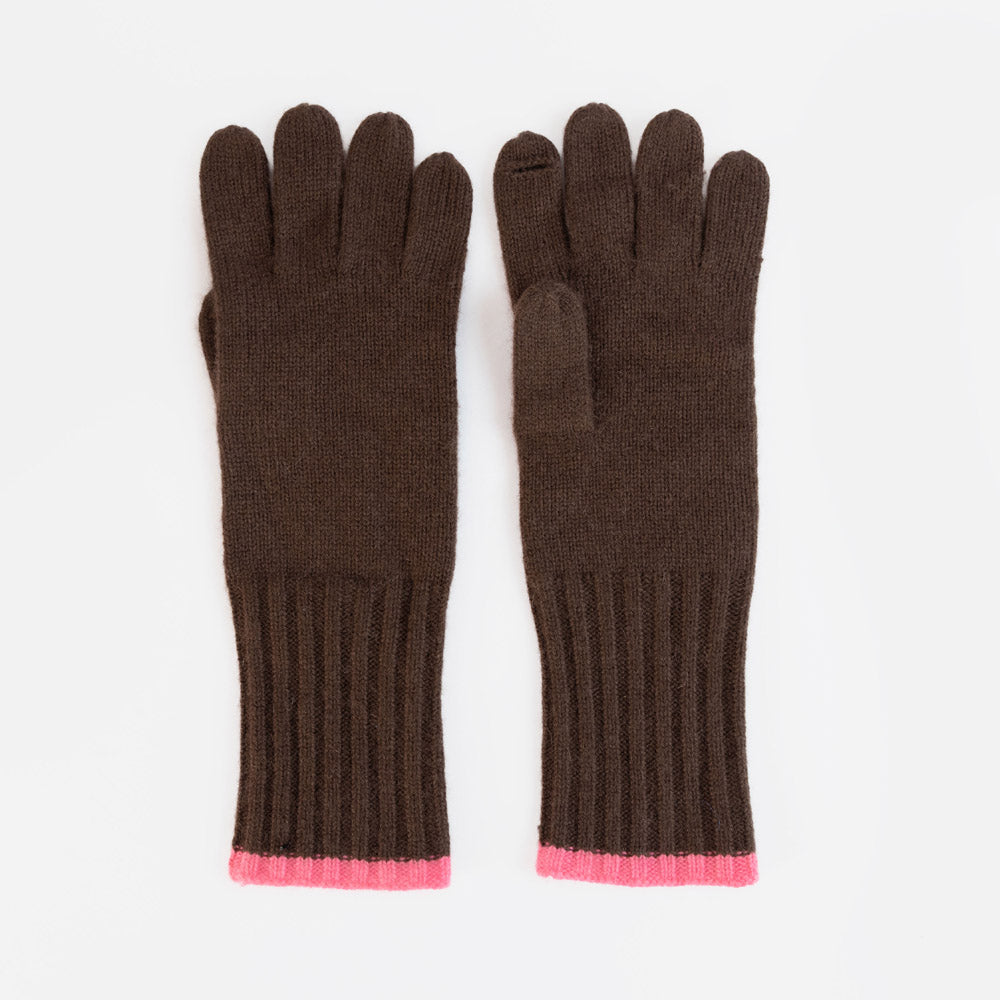 A pair of dark brown knit gloves with a vibrant pink ribbed trim at the cuffs, displayed flat against a clean white background.