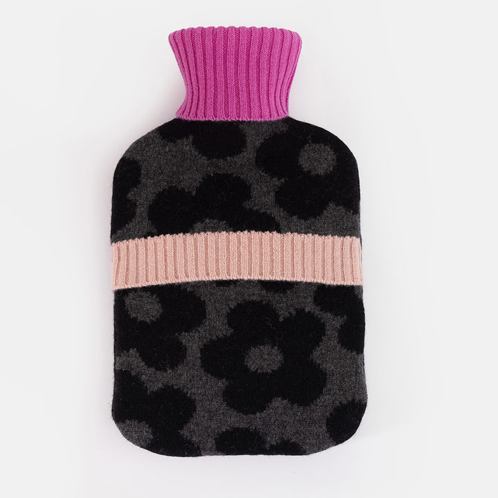 Back of a charcoal and black flower merino hot water bottle with a fuchsia ribbed neck and blush pink cashmere ribbed band