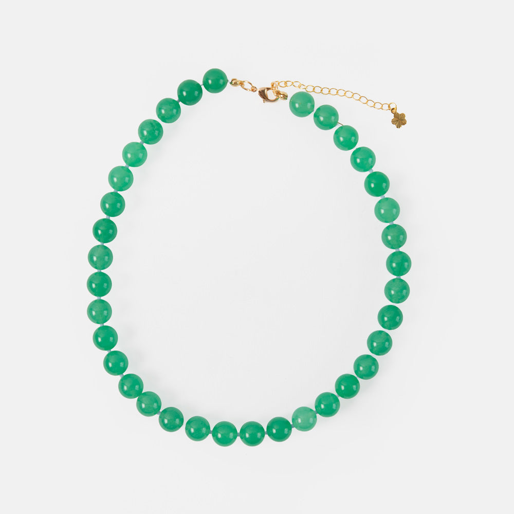 green beaded necklace with gold hardware