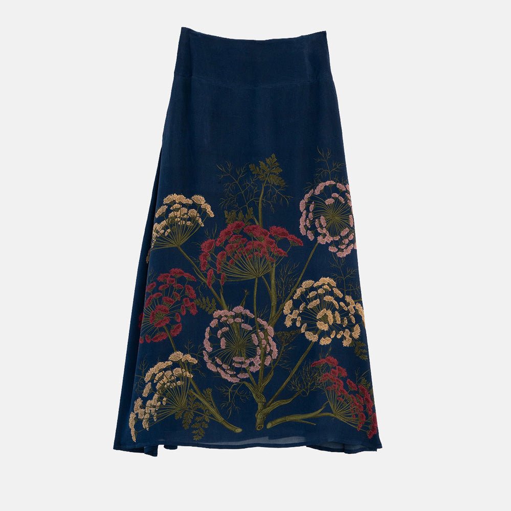 women's navy blue a-line sirt featuring a design of parsley flowers in pink, yellow and red with green stems 