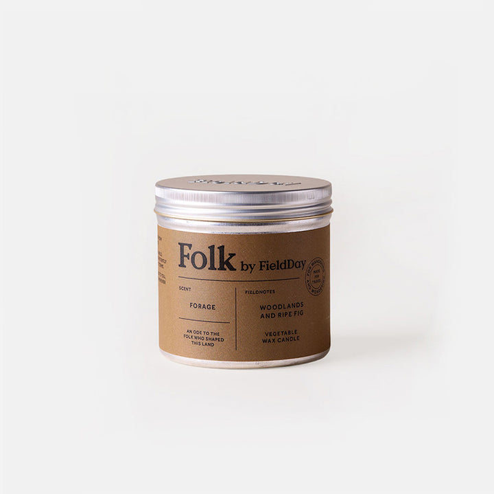 a metal tinned candle from Folk by Field Day, with 'forage' scent of woodland & wild wig