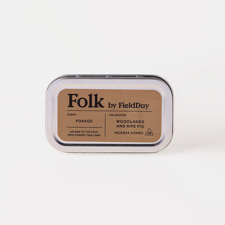 A silver metal tin of Folk by FieldDay Incense Cones, featuring a kraft paper label with black text, set against a clean white background.