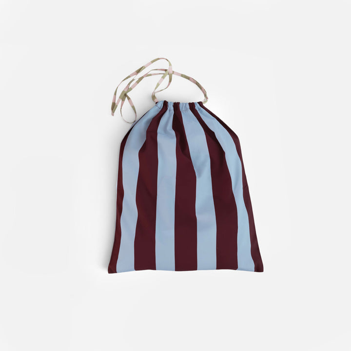 Drawstring cotton bag in wide blue and wine stripes with a pastel striped cord