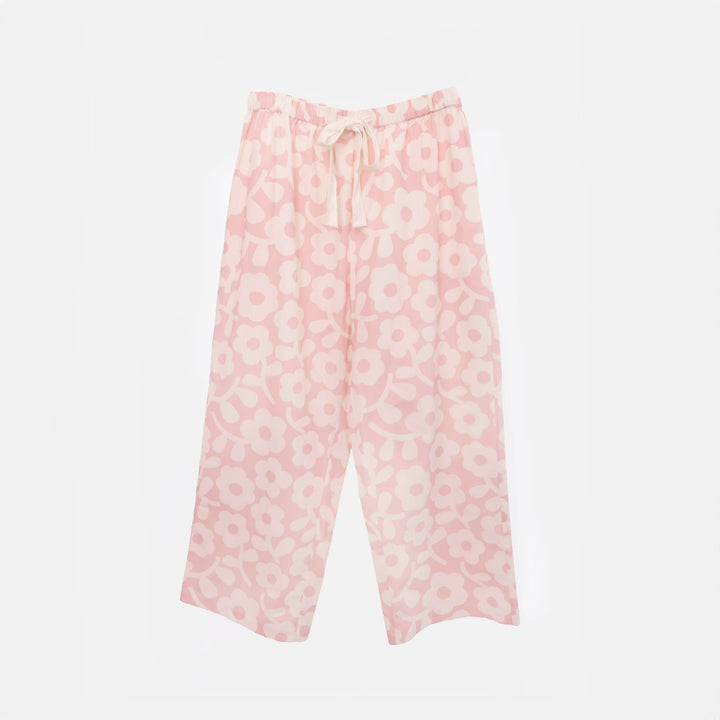 Wide-leg pale pink pyjama trousers with a cream flower print and a cream drawstring tie