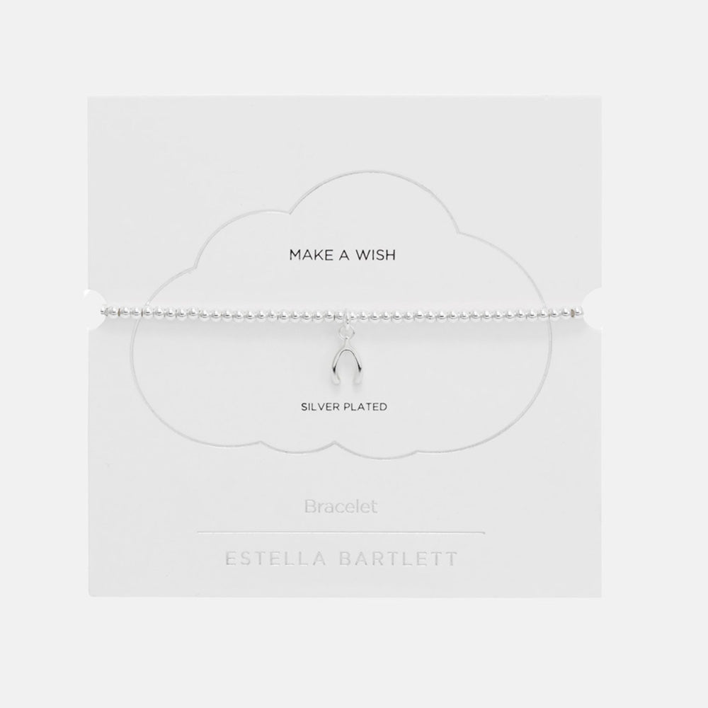 Silver beaded stretch bracelet with a small wishbone charm, presented on a white cloud-shaped card reading Make a Wish