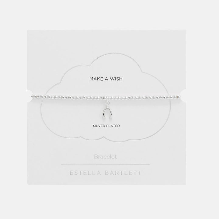 Silver beaded stretch bracelet with a small wishbone charm, presented on a white cloud-shaped card reading Make a Wish