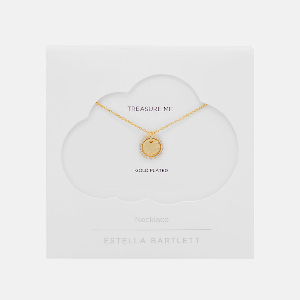 Fine gold chain necklace with a round hammered coin pendant edged in sparkling stones, presented on a white cloud-shaped card reading Treasure Me