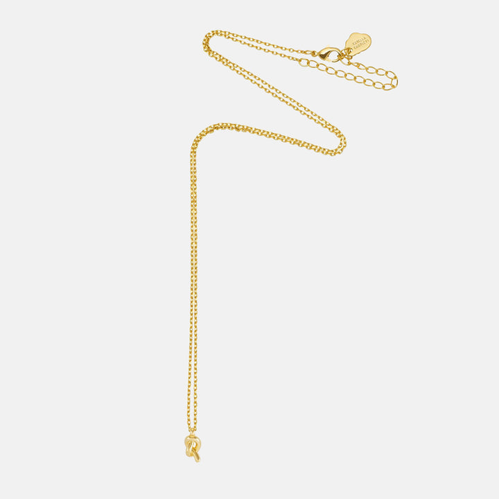 Fine gold chain necklace with a small knot pendant