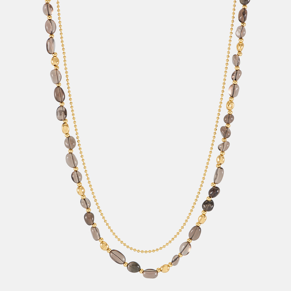 Double strand necklace with a fine gold beaded chain and a strand of brown smoky quartz beads