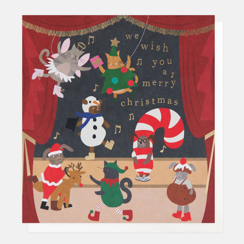 Christmas card featuring an illustration of animals in Christmas costumes on a stage with a chalkboard background.