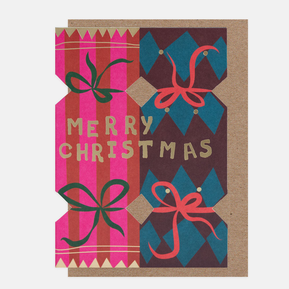 Christmas card with cut out colourful Christmas crackers and 'Merry Christmas' text on a patterned background
