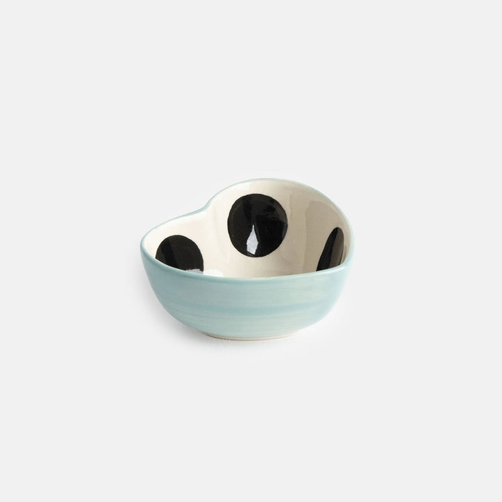 heart shaped hand painted glazed ceramic stoneware trinket bowl qith a black spot inside and light blue outer design