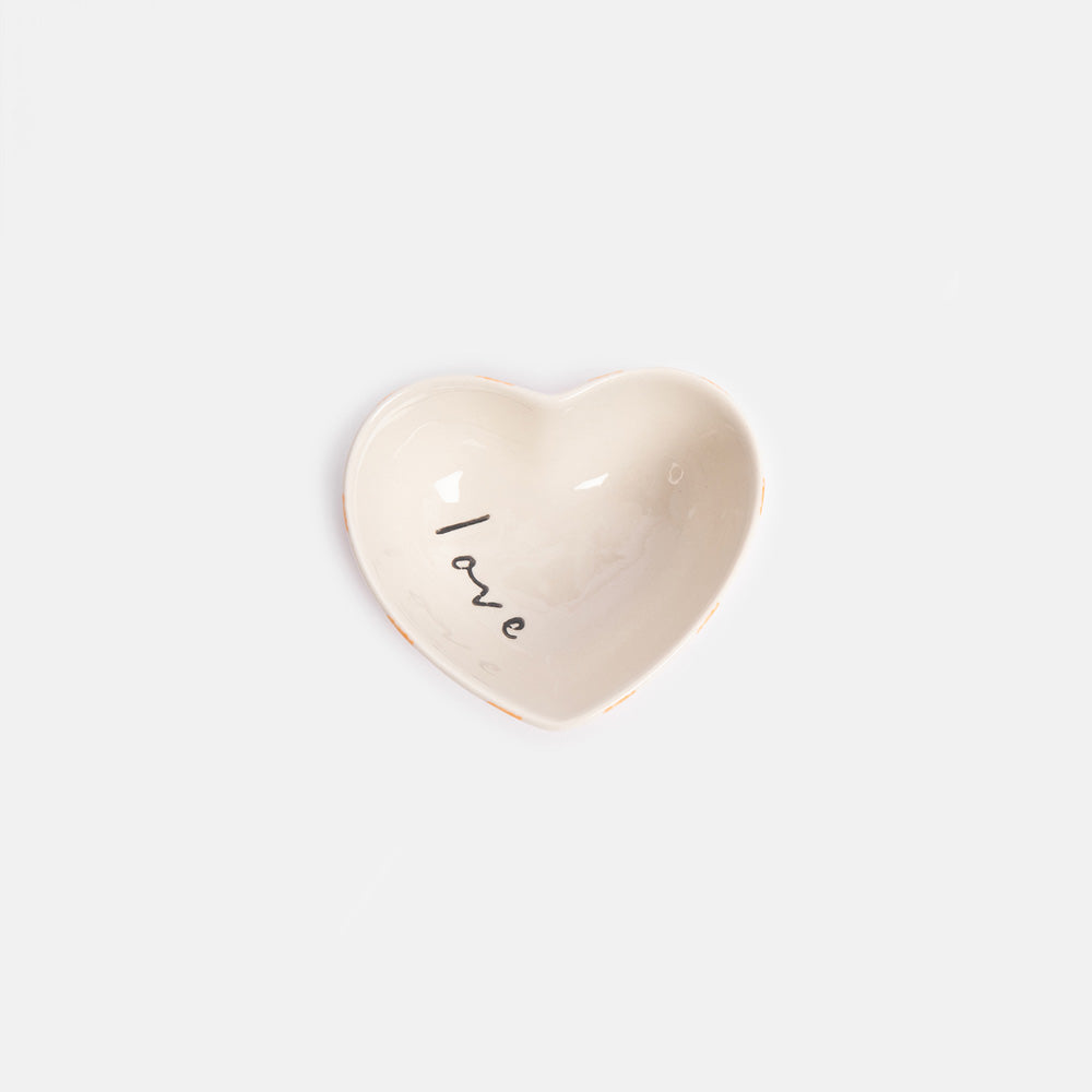 Small heart shaped ceramic dish with 'love' wording on the inside