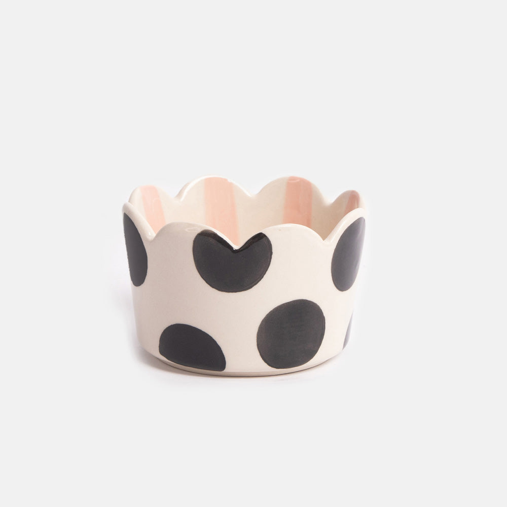 scalloped rim trinket dish with black spot exterior and light pink stripe interior design