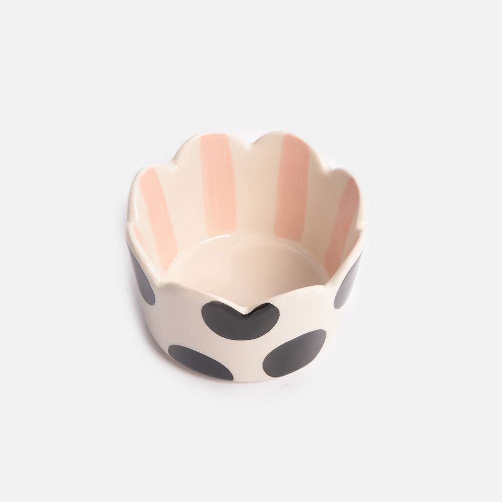 scalloped rim trinket dish with black spot exterior and light pink stripe interior design