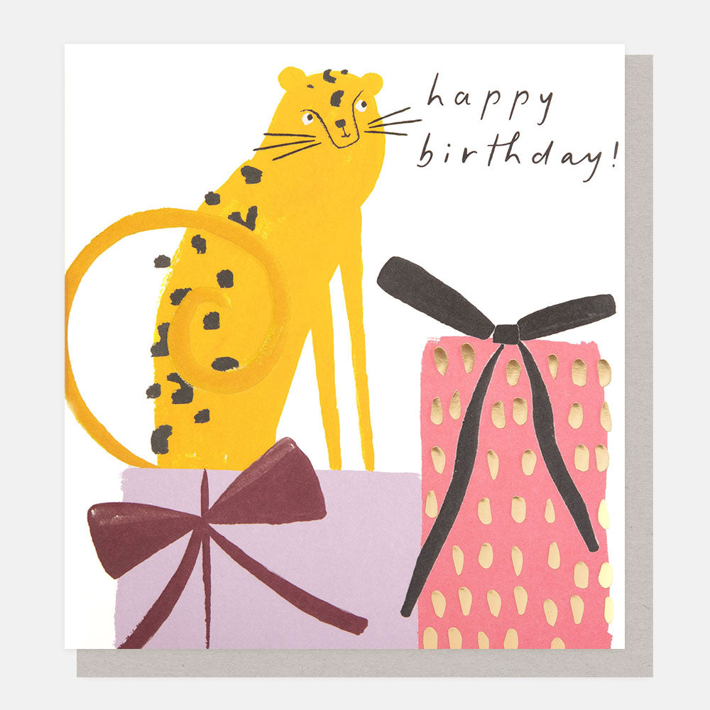 spotty leopard sitting on a stack of presents happy birthday card