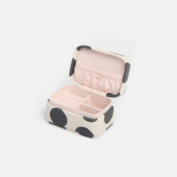 mini jewellery box with monochrome spot outer and pink lining with rings section, and compartments for earrings, necklaces or bracelets