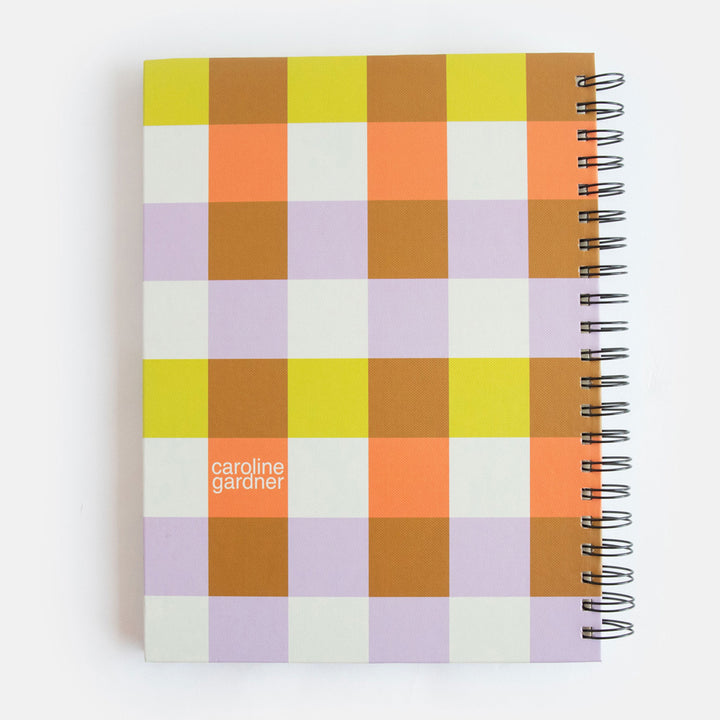 a4 spiral bound hardcover notebook with a warm tones checked print cover