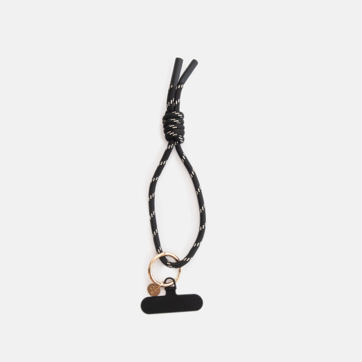 black & white cord phone strap with gold o-ring and black universal adapter