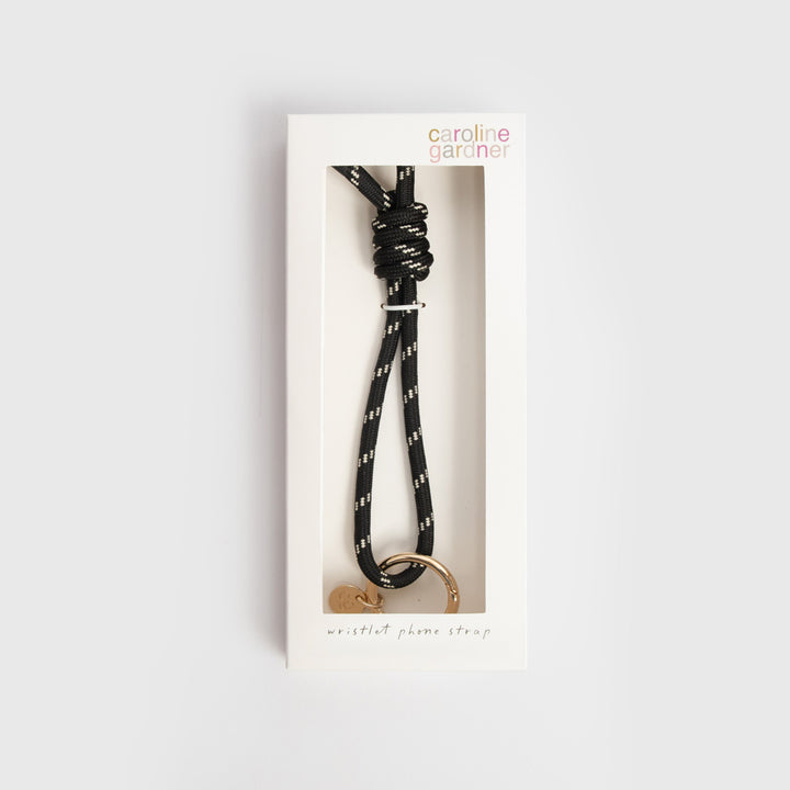 black & white cord phone strap with gold o-ring and black universal adapter in 'caroline gardner' branded box