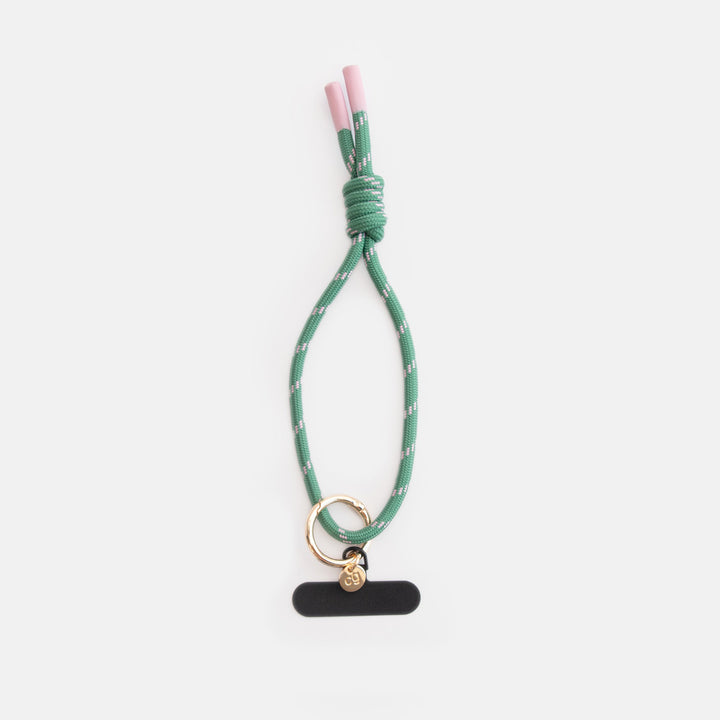 green & pink cord phone strap with gold cg branded disc and universal phone case adapter