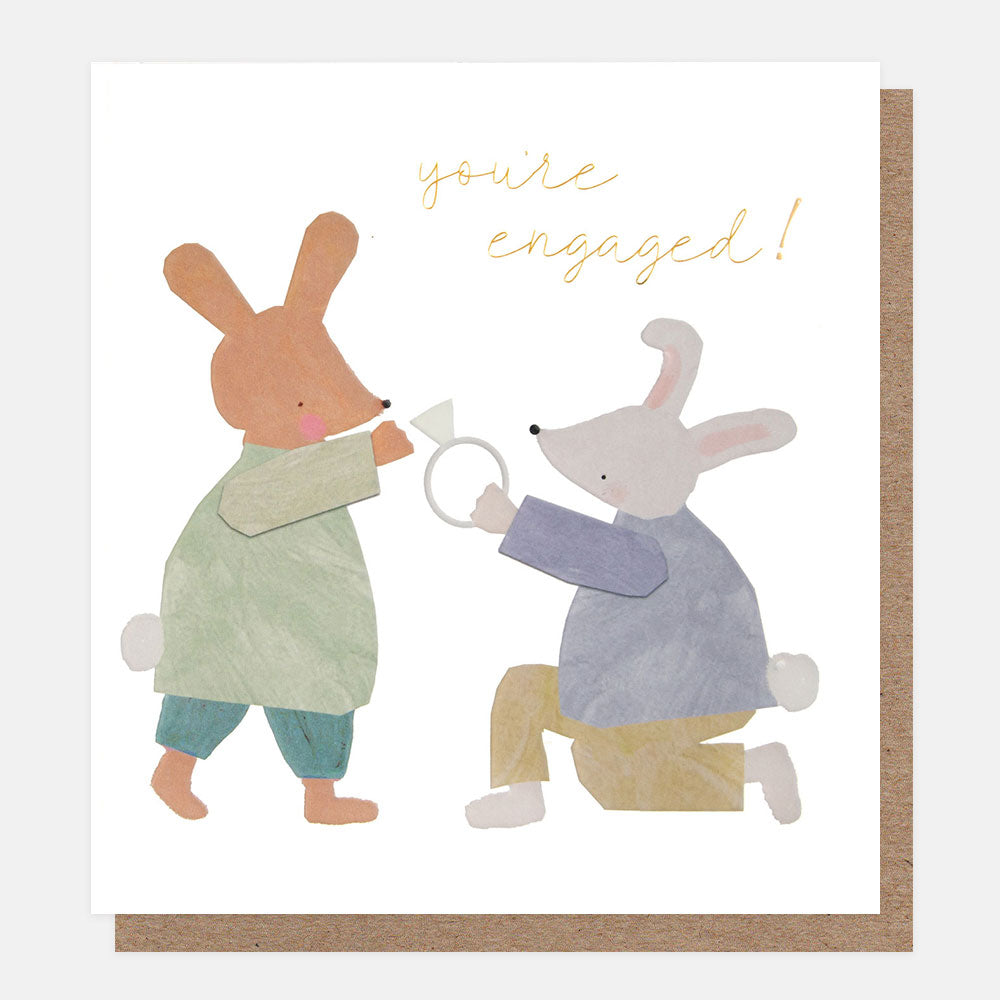 Card with two cartoon bunnies holding a ring, text 'you're engaged!', on a white background.