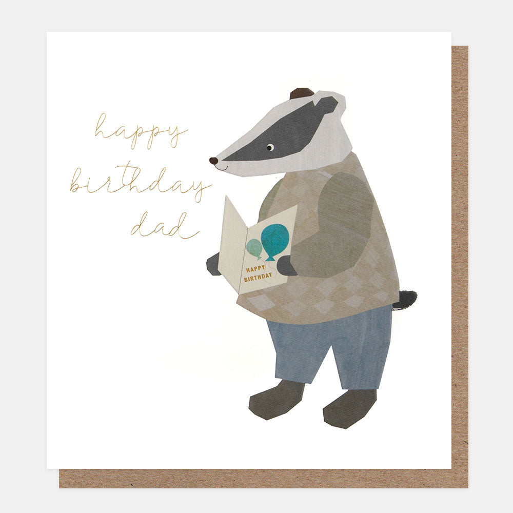birthday card featuring a badger in trousers and a jumper holding a birthday card and the text 'happy birthday dad' on a white background 